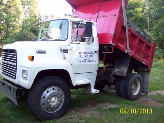 We also haul sand, gravel, topsoil, mulch & boulders.