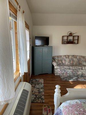 Garden cabin, front door, tv and couch