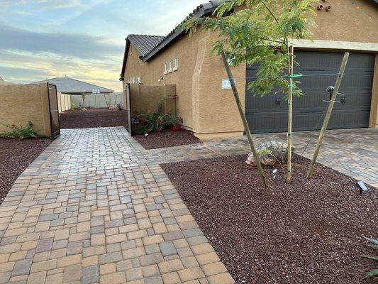 Side yard to back yard rear wall. Beautiful paving job by juan