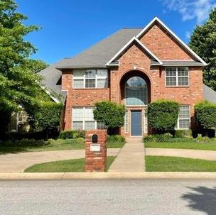 A stately, all brick two story home in the Tanglewood subdivision.