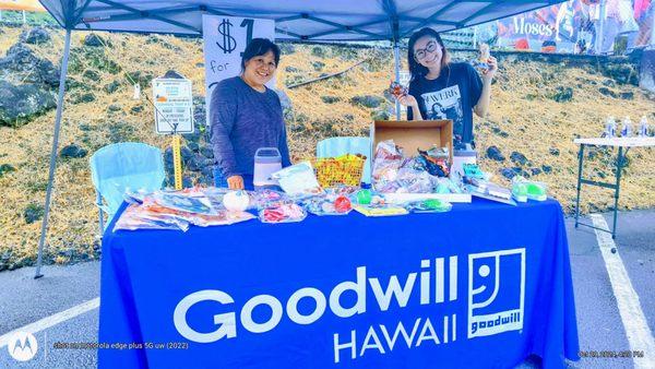 YMCA Hilo 2024 Halloween Carnival, 10/29. Audrey & Aileen, "Water Ring Toss" game @ the Goodwill Hawai'i tent. Look at all those prizes!