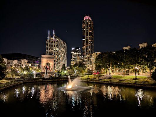 Atlantic Station bridge, pond, and fountain with Millennium Gate Museum (arch) in background. Friday, October 18, 2024 at 7:54 PM EDT.