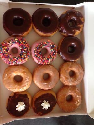 Our Sunday dozen! Nicely frosted except the rushed chocolate, still wouldn't eat the glazed.