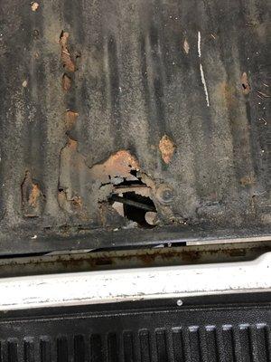 Major rust damage, covered up by a bedliner