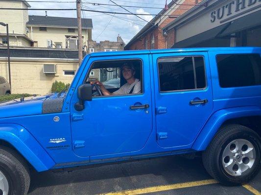 My son driving out with his new car!