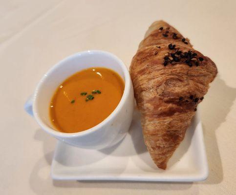 Complimentary tomato soup and croissant