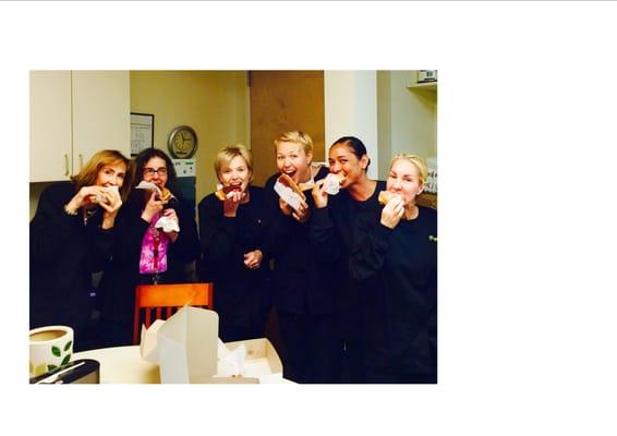 Our staff celebrating #NationalDoughnutDay with delicious doughnuts from a local bakery.