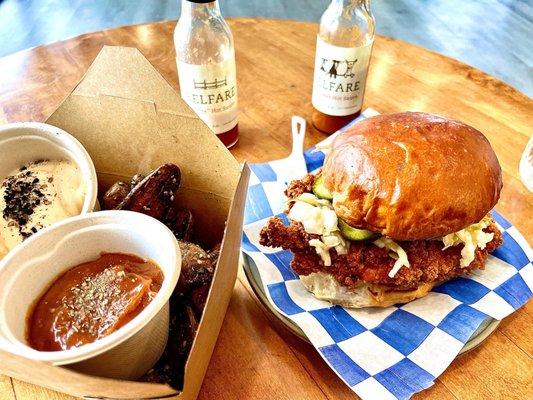 Classic chicken sandwhich and their furikake fingerling potatoes along with the house made ketchup and aioli. Hot sauces in the back