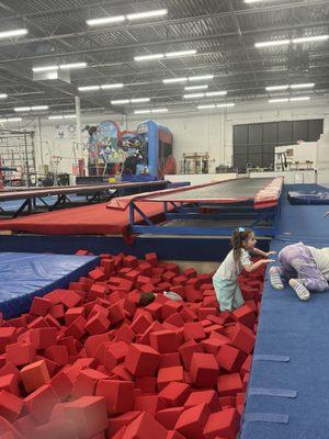 Long trampoline into foam pit