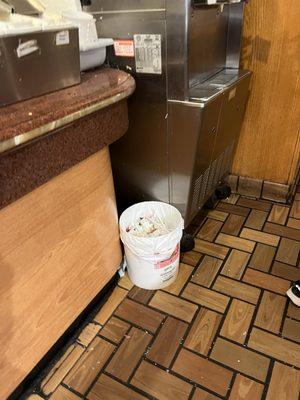 Disgusting trash next to the broken ice cream maker.  Picture doesn't do it justice with how gross this place is