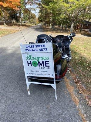 I found a way to merge my love of riding with the necessary tasks of putting out and picking up signs and lock boxes.