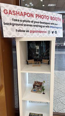 Gashapon "Photo Booth" cubbies in a bookshelf