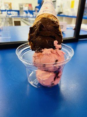 Cherry Cordial and Chocolate Raspberry scoops on a waffle cone