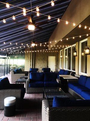 Outdoor terrace with fire-pit and lights