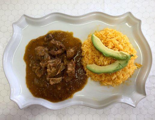 Seco de chivo, goat stew with yellow rice