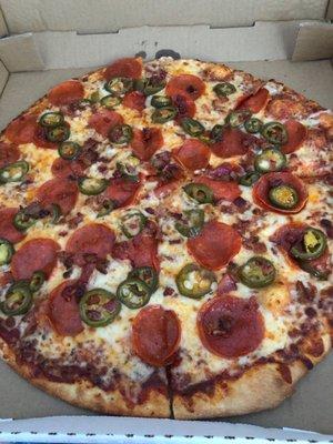 Pepperoni, bacon and jalapeño pizza. Thin crust.