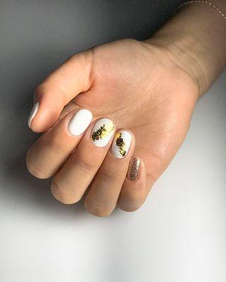 Gel Manicure with warm gold glitter and foil design