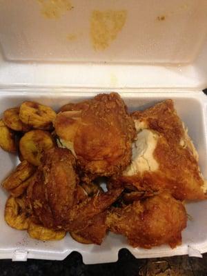 Fried half chicken and yellow plantains.