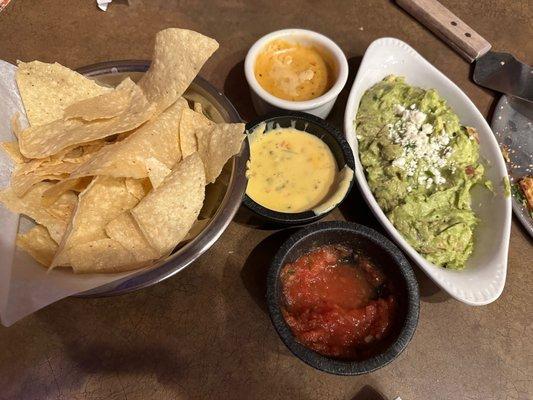 Chips, guacamole, queso, salsa and Diablo sauce