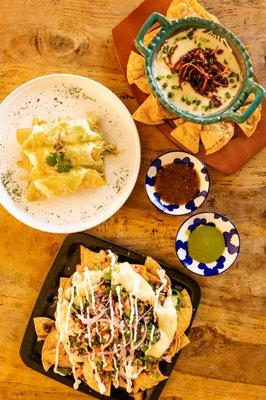 Queso Fundido, Enchiladas Suizas and delicious nachos accompanied with in-house made salsas.