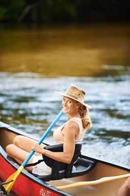 Try a canoe with a seatback for added comfort