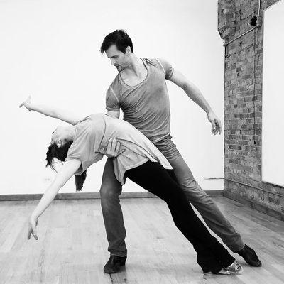 Instructors Samuel and Emilee practicing a bolero