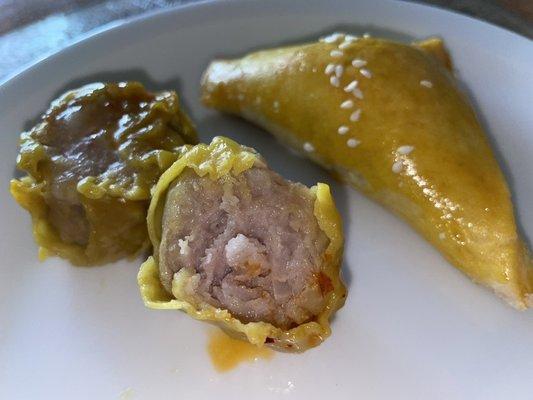 The meat texture of the siu mai was smooth or ground and had a firm spongey texture.