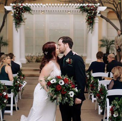 Burgundy, white, black and emerald green wedding florals