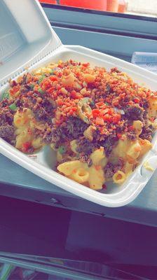 This is the Fin-E-Mac Bowl.!! Homemade macaroni topped with brisket, onions,chives,jalapeños,bacon bits, and bbq sauce