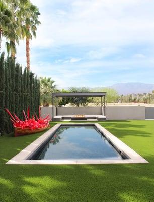 Sculpture garden: Chihuly Scarlet Fire Boat with reflection pool and cabana