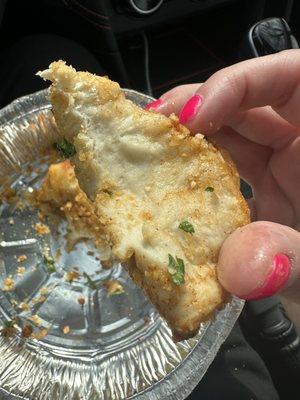 Raw dough inside garlic knot