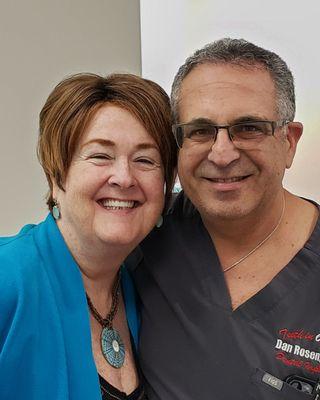 Dr. Dan Rosen DDS and I on the final day of my dental journey. Showing off my upper and lower implant supported fixed bridges.