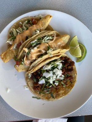 Two Taco de Pescado and one Taco de Carnitas