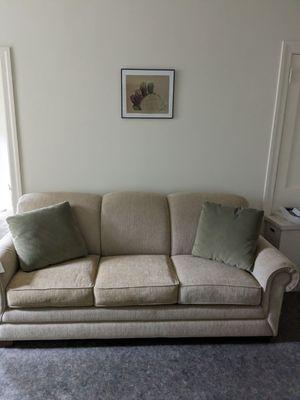 three-seat sleeper sofa fits perfectly against wall of the apartment