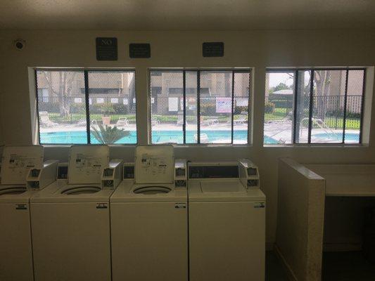 Laundry Room Behind Leasing Office with Pool View