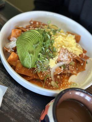 Red Chilaquiles   18.5 Corn tortillas, onion, sour cream, queso fresco, avocado & 2 eggs.