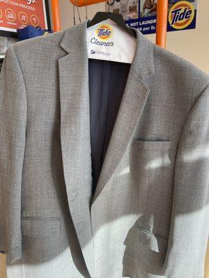 See the lapel is pressed way too low below the buttons and very uneven.