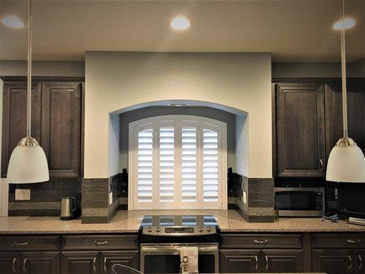 These white composite shutters look gorgeous in this arch shaped window!!