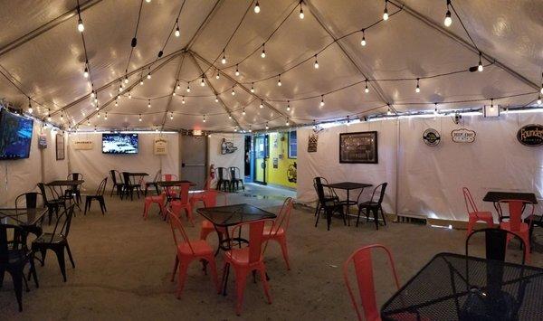 Patio, covered and heated with 2 TV's. Plenty of space out here for socially distanced dining.