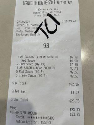 Receipt charging us for two smothered burritos.