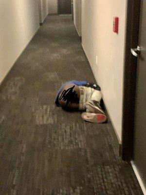 A homeless man is sleeping in the corridor. I made an effort to conceal the fact that his pants were down.