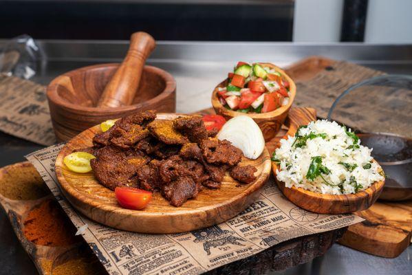 Traditional Nigerian Beef Suya with cilantro rice and cucumber salad