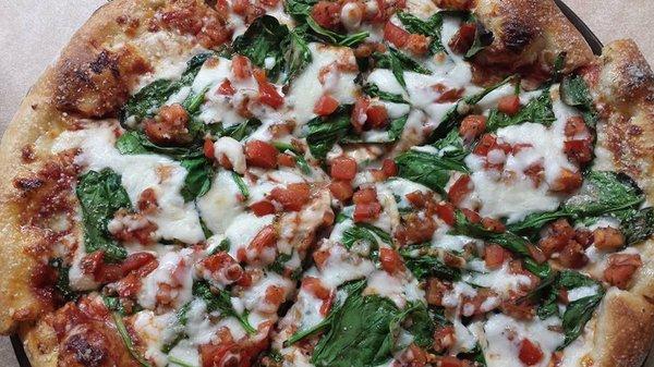 Bruschetteria: Our homemade crust covered wi thour own pizza sauce, mozzarella cheese, fresh spinach and our bruschetta mix, and more!