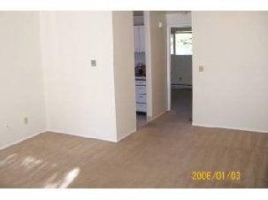 Living room with hallway to bathroom and bedroom