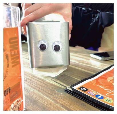 Napkin holder with googly eyes