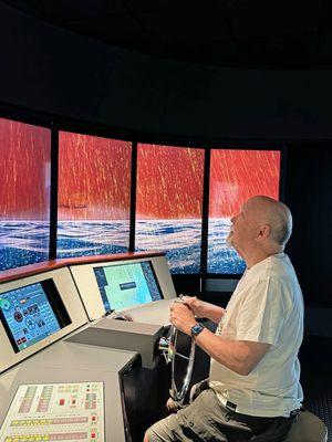 In the wheelhouse (ship's bridge) simulator.