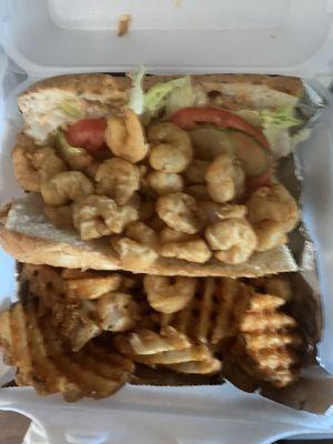 Shrimp Poboy Sandwich with waffle fries.