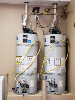 Twin 50 gallon power vent water heaters.