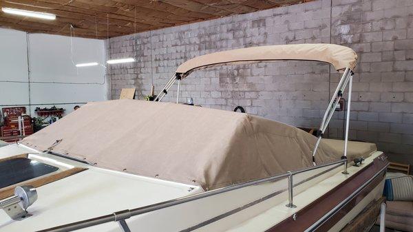 Snap on Boat cover with matching bimini top & boot Made with Sunbrella Canvas & Tenara thread designed to withstand the harsh sun.