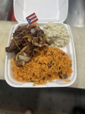 Rice and gandules with steak and onions with potato salad